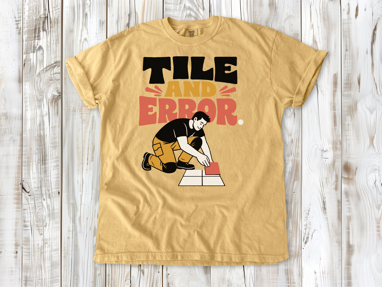 Burnt Orange garment-dyed tee with Tile and Error tile setter graphic.