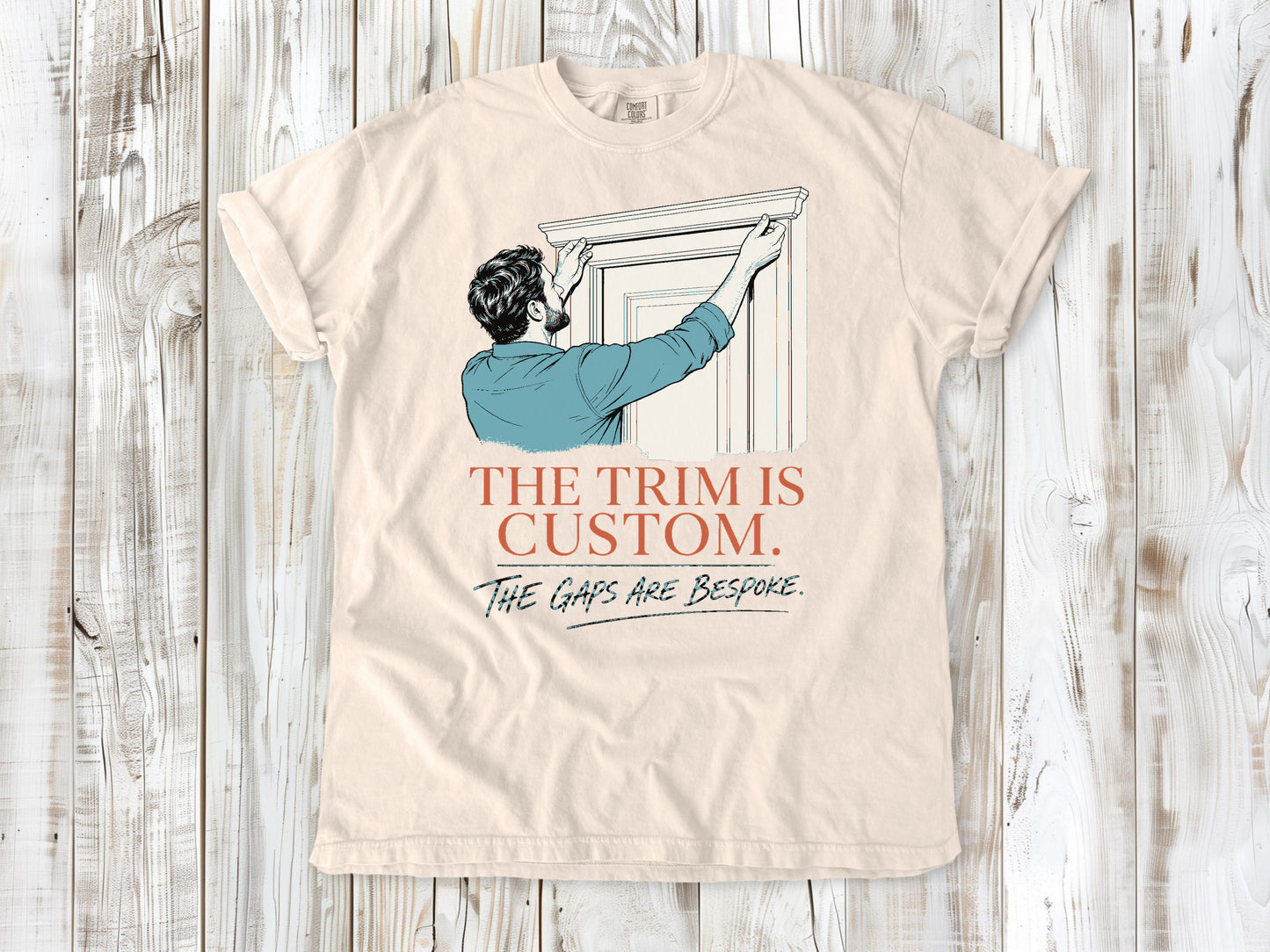 Butter garment-dyed tee with The Trim Is Custom The Gaps Are Bespoke finish carpentry graphic.