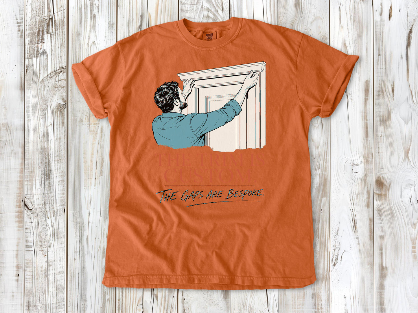 Seafoam garment-dyed tee with The Trim Is Custom The Gaps Are Bespoke finish carpentry graphic.