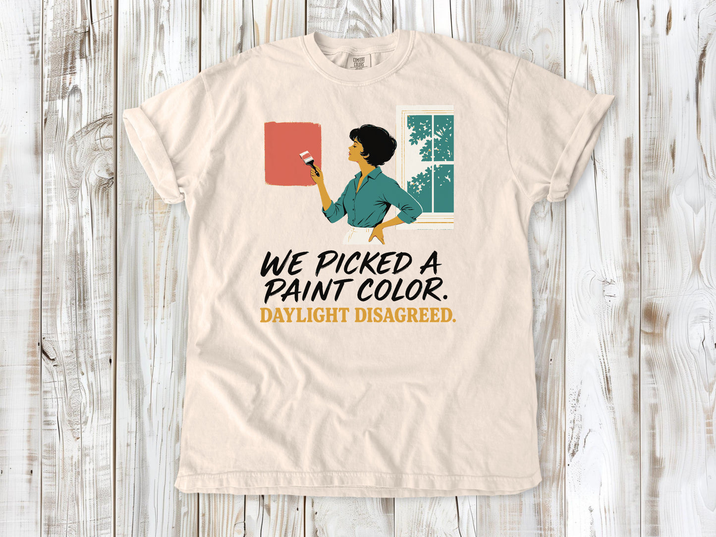 Butter garment-dyed tee with We Picked a Paint Color Daylight Disagreed painting graphic.