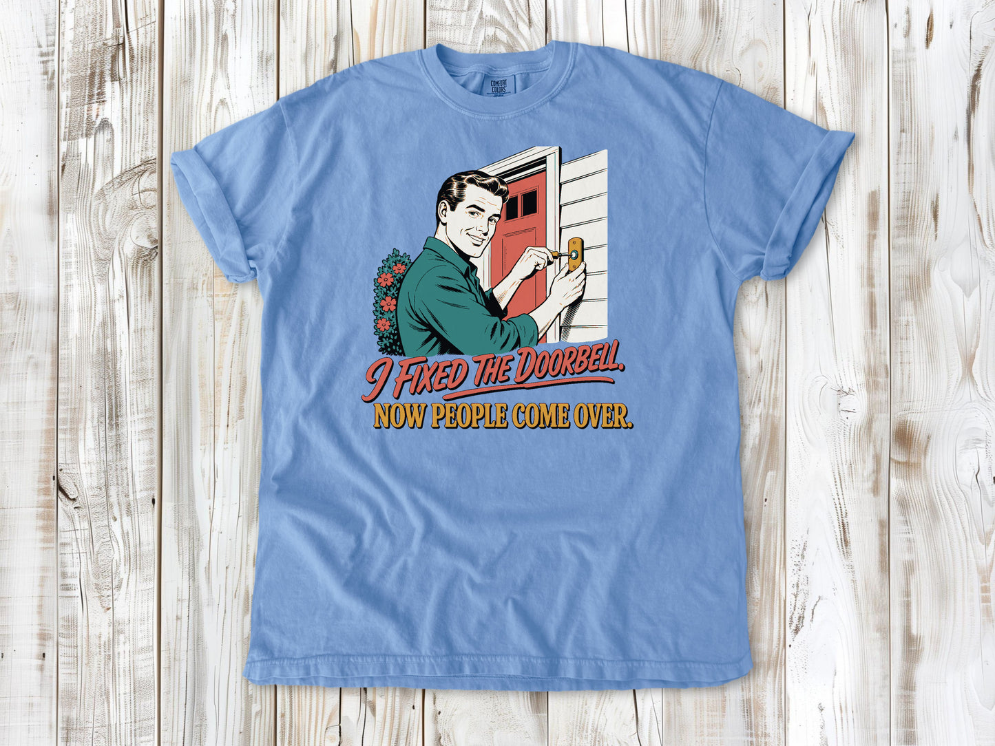 Pepper garment-dyed tee with I Fixed the Doorbell Now People Come Over DIY graphic.