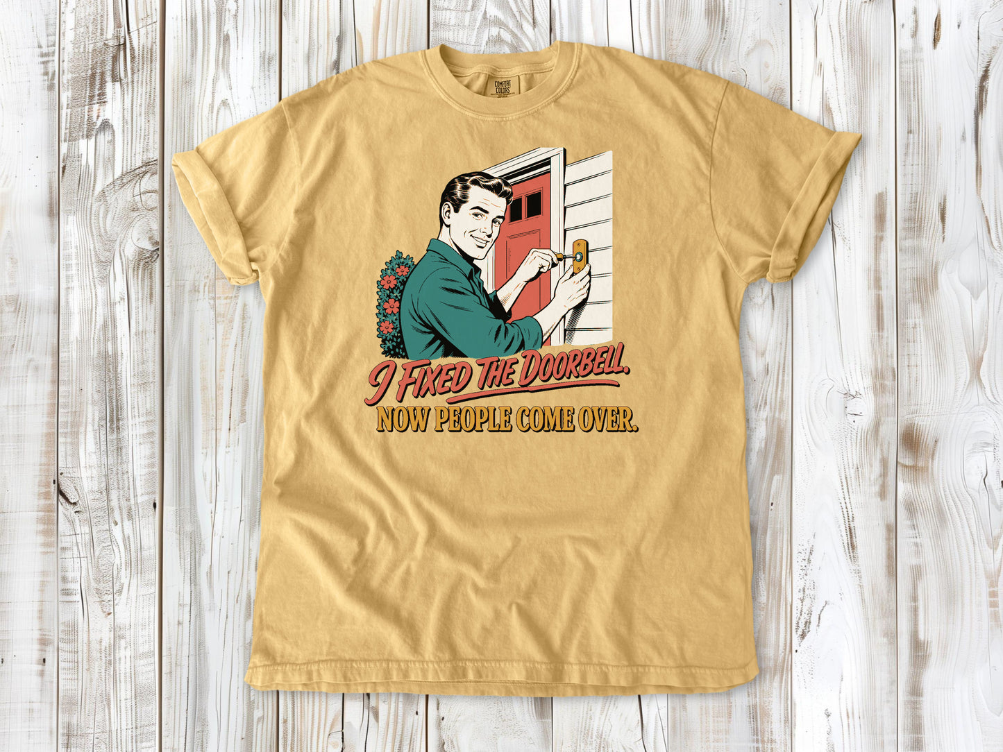Burnt Orange garment-dyed tee with I Fixed the Doorbell Now People Come Over DIY graphic.