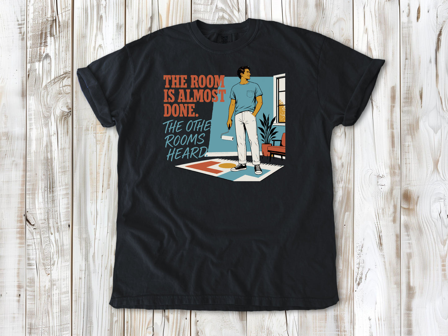 Washed Denim garment-dyed tee with The Room Is Almost Done The Other Rooms Heard renovation graphic.