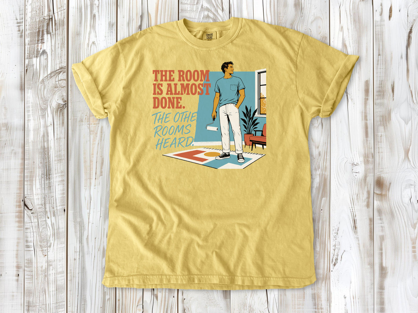 Grey garment-dyed tee with The Room Is Almost Done The Other Rooms Heard renovation graphic.