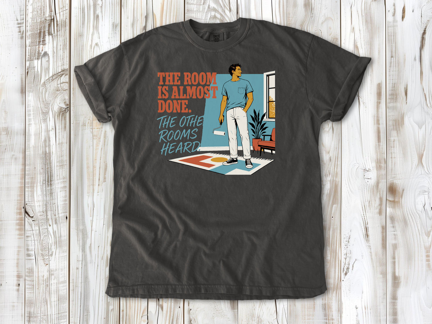 Ivory garment-dyed tee with The Room Is Almost Done The Other Rooms Heard renovation graphic.