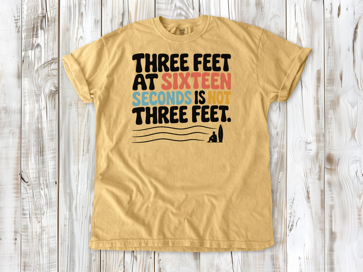 Burnt Orange garment-dyed tee with Three Feet at Sixteen Seconds Is Not Three Feet surf forecast graphic.