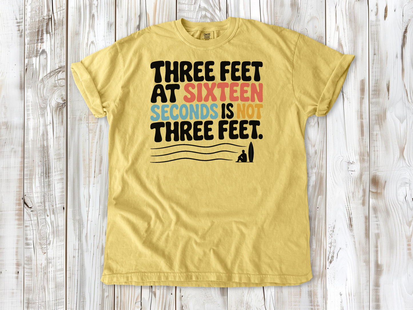 Grey garment-dyed tee with Three Feet at Sixteen Seconds Is Not Three Feet surf forecast graphic.