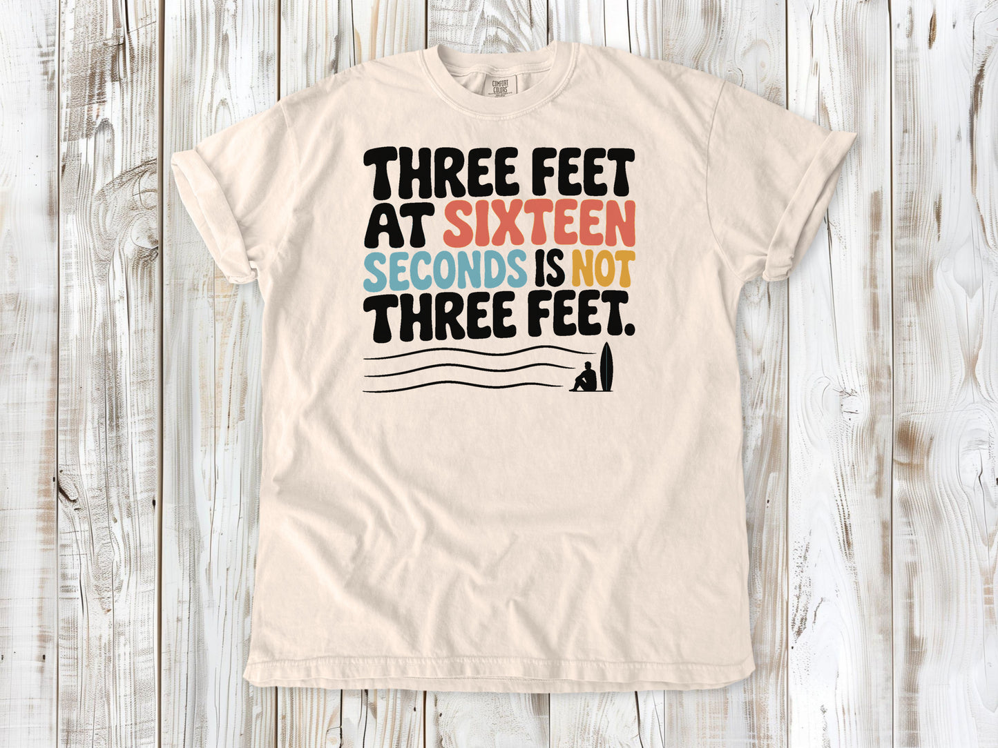 Butter garment-dyed tee with Three Feet at Sixteen Seconds Is Not Three Feet surf forecast graphic.