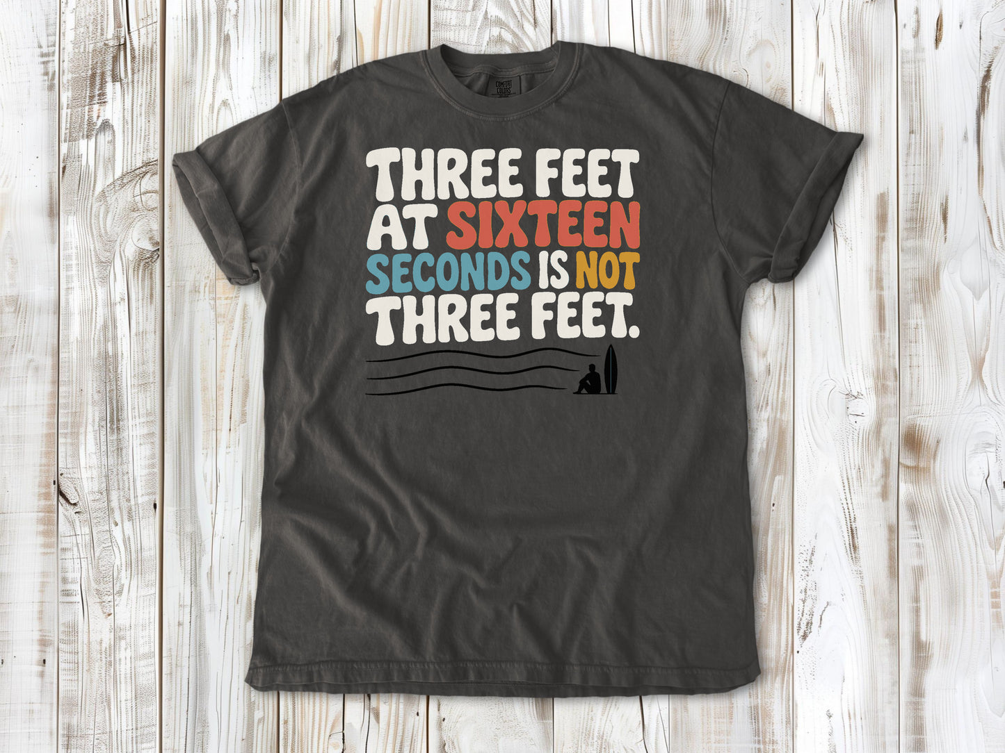 Ivory garment-dyed tee with Three Feet at Sixteen Seconds Is Not Three Feet surf forecast graphic.