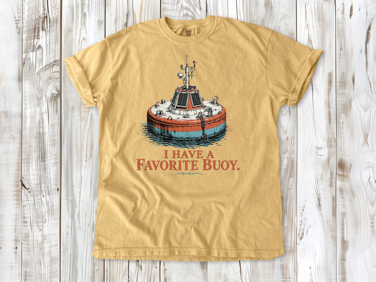 Burnt Orange garment-dyed tee with I Have a Favorite Buoy surfing graphic.