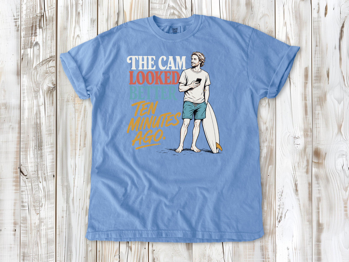 Pepper garment-dyed tee with The Cam Looked Better Ten Minutes Ago surfer graphic.