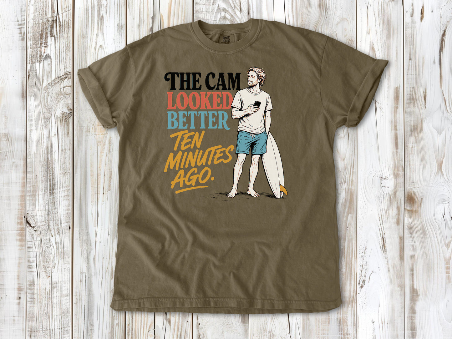 Graphite garment-dyed tee with The Cam Looked Better Ten Minutes Ago surfer graphic.