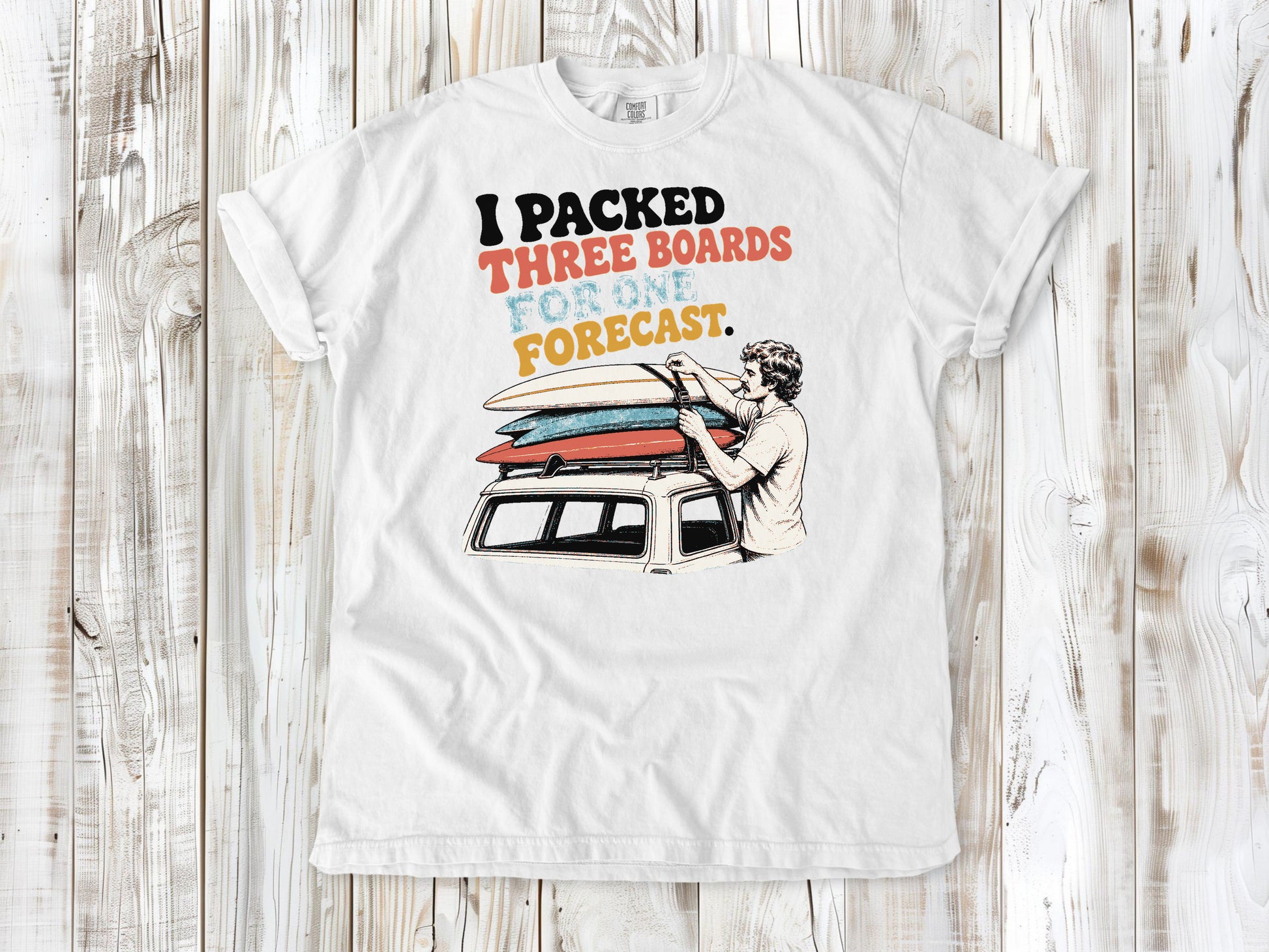 White garment-dyed tee with I Packed Three Boards for One Forecast surfboard graphic.