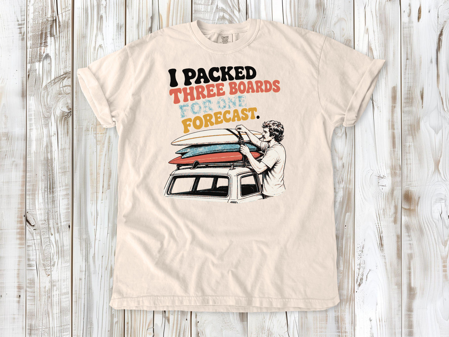 Butter garment-dyed tee with I Packed Three Boards for One Forecast surfboard graphic.