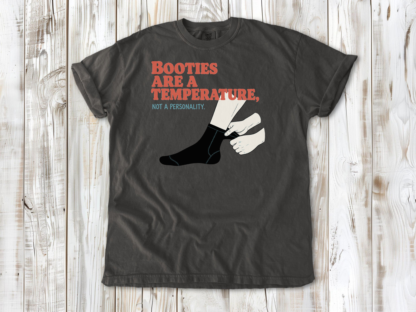 Ivory garment-dyed tee with Booties Are a Temperature Not a Personality cold water surfing graphic.