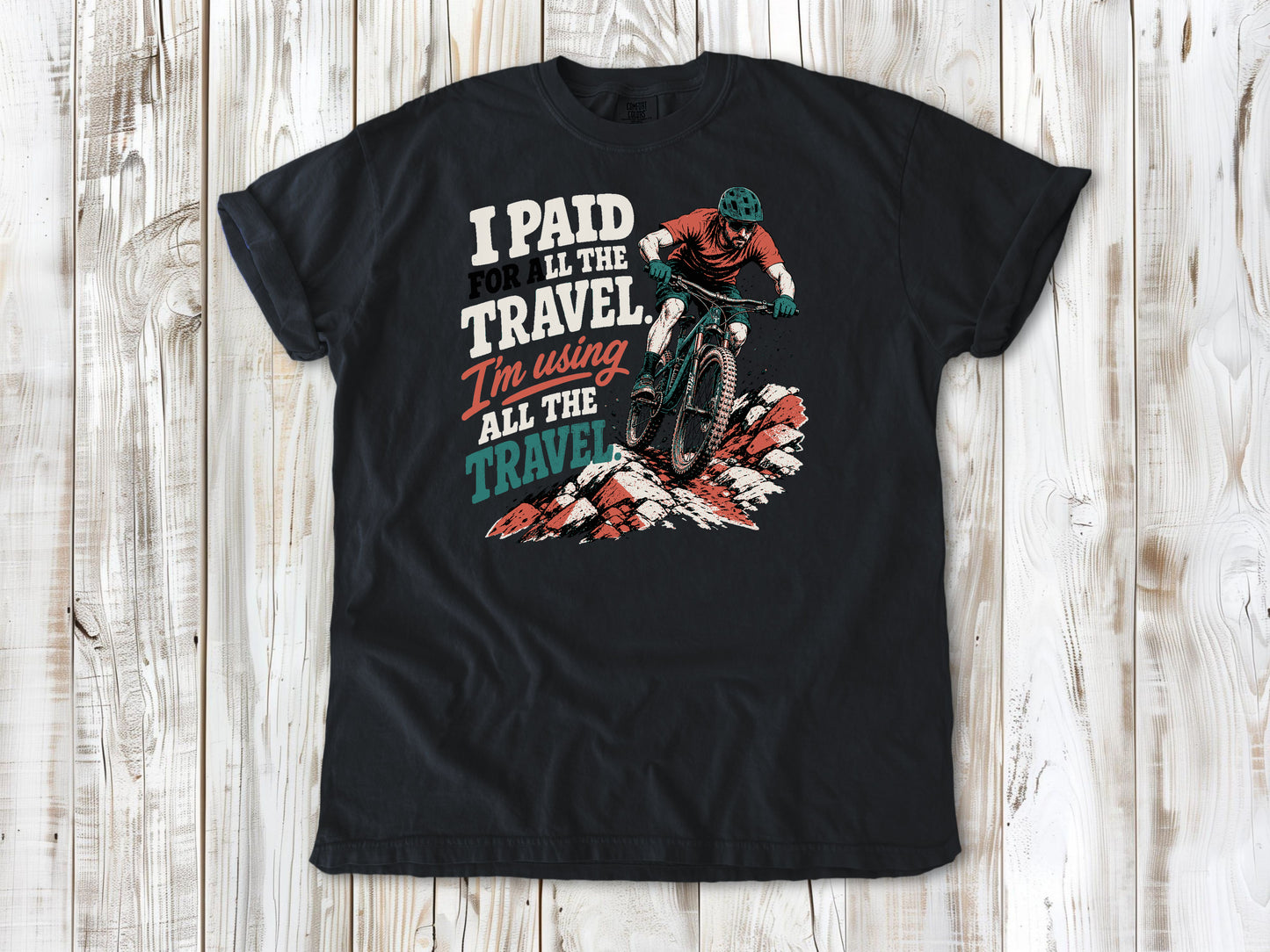 Washed Denim garment-dyed tee with I Paid for All the Travel mountain bike graphic.