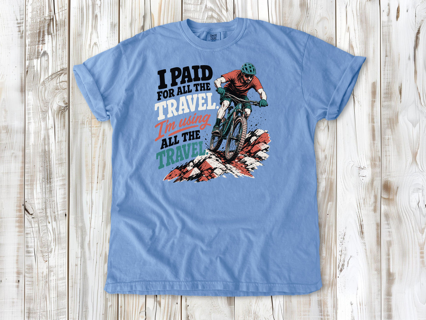 Pepper garment-dyed tee with I Paid for All the Travel mountain bike graphic.