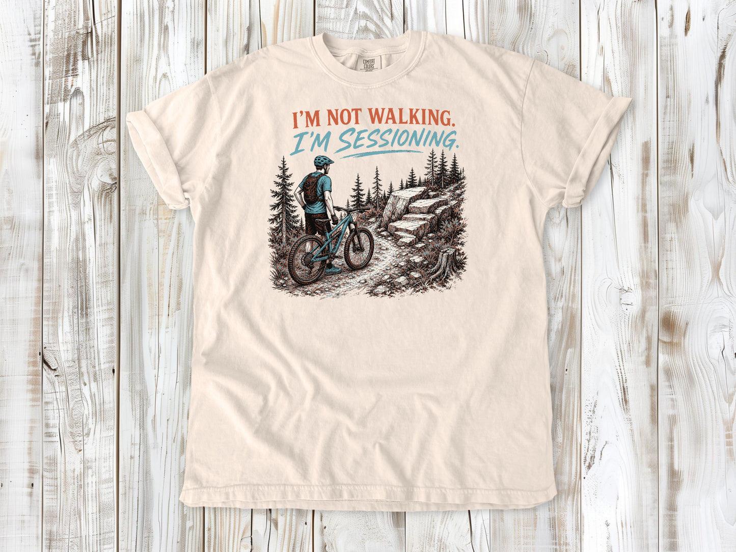 Butter garment-dyed tee with I'm Not Walking I'm Sessioning mountain biking graphic.
