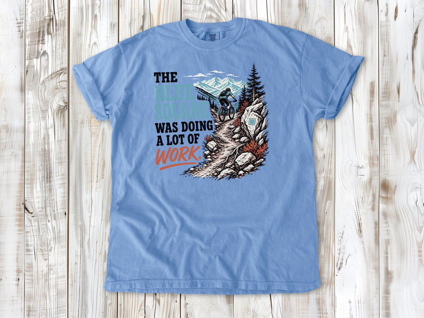 Pepper garment-dyed tee with The Blue Square Was Doing a Lot of Work mountain bike trail graphic.