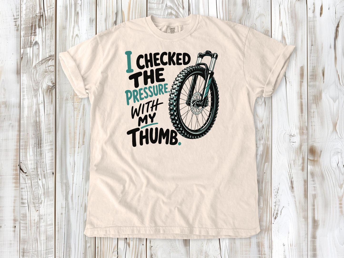 Butter garment-dyed tee with I Checked the Pressure With My Thumb mountain bike tire graphic.