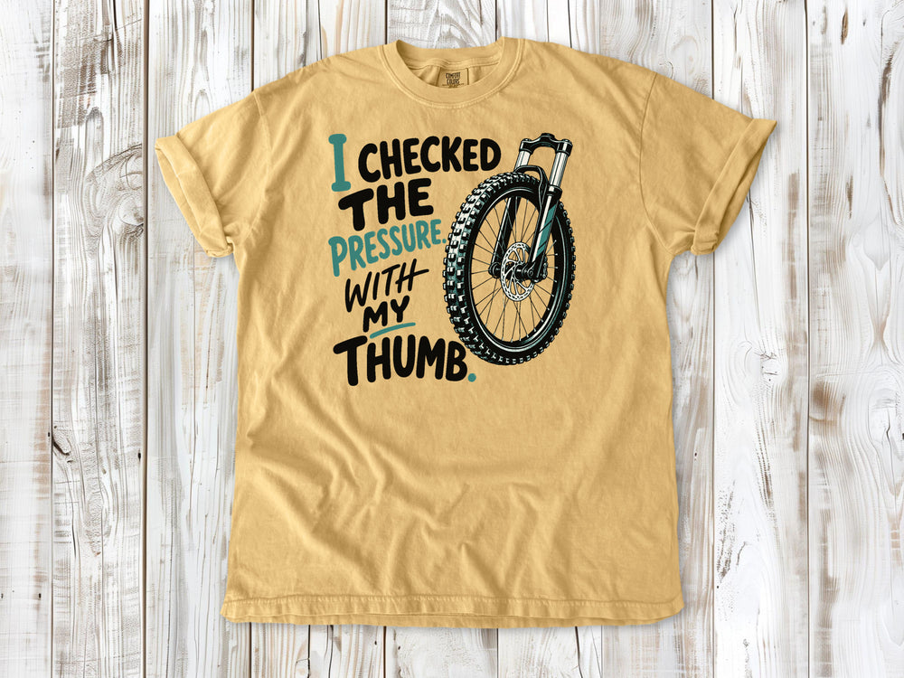 Burnt Orange garment-dyed tee with I Checked the Pressure With My Thumb mountain bike tire graphic.