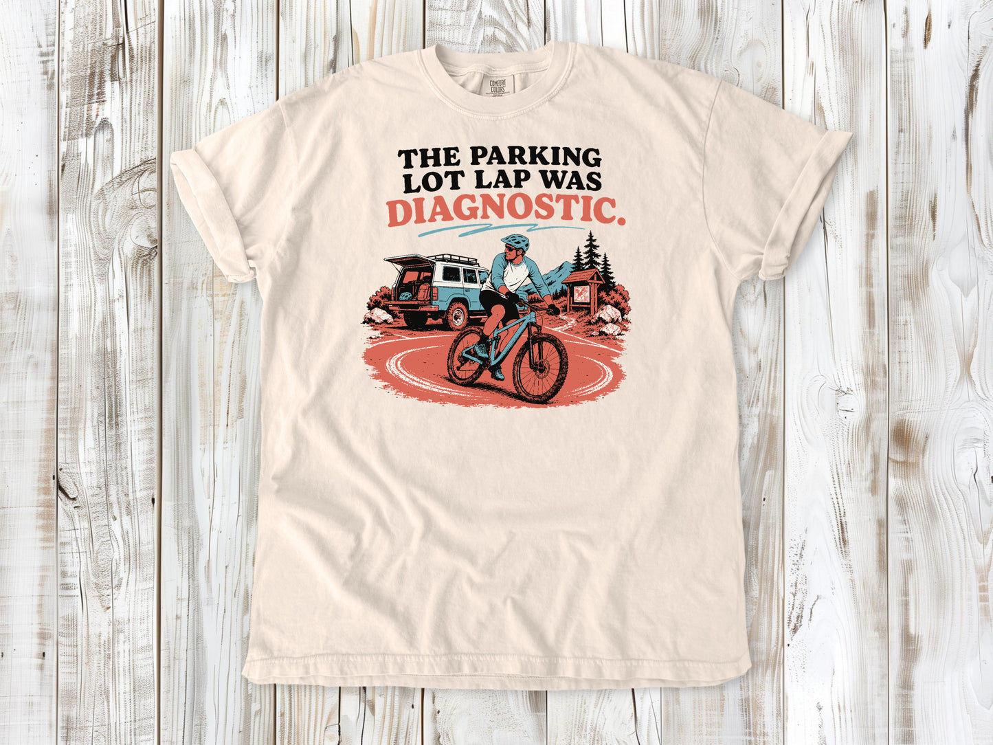 Butter garment-dyed tee with The Parking Lot Lap Was Diagnostic mountain biking graphic.