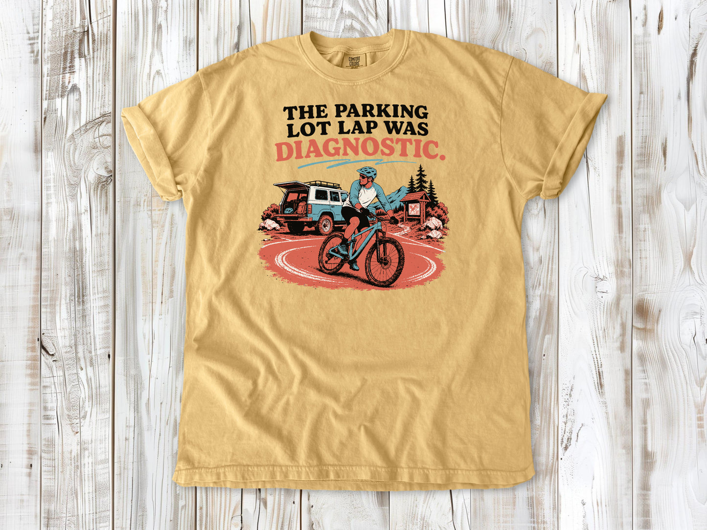 Burnt Orange garment-dyed tee with The Parking Lot Lap Was Diagnostic mountain biking graphic.