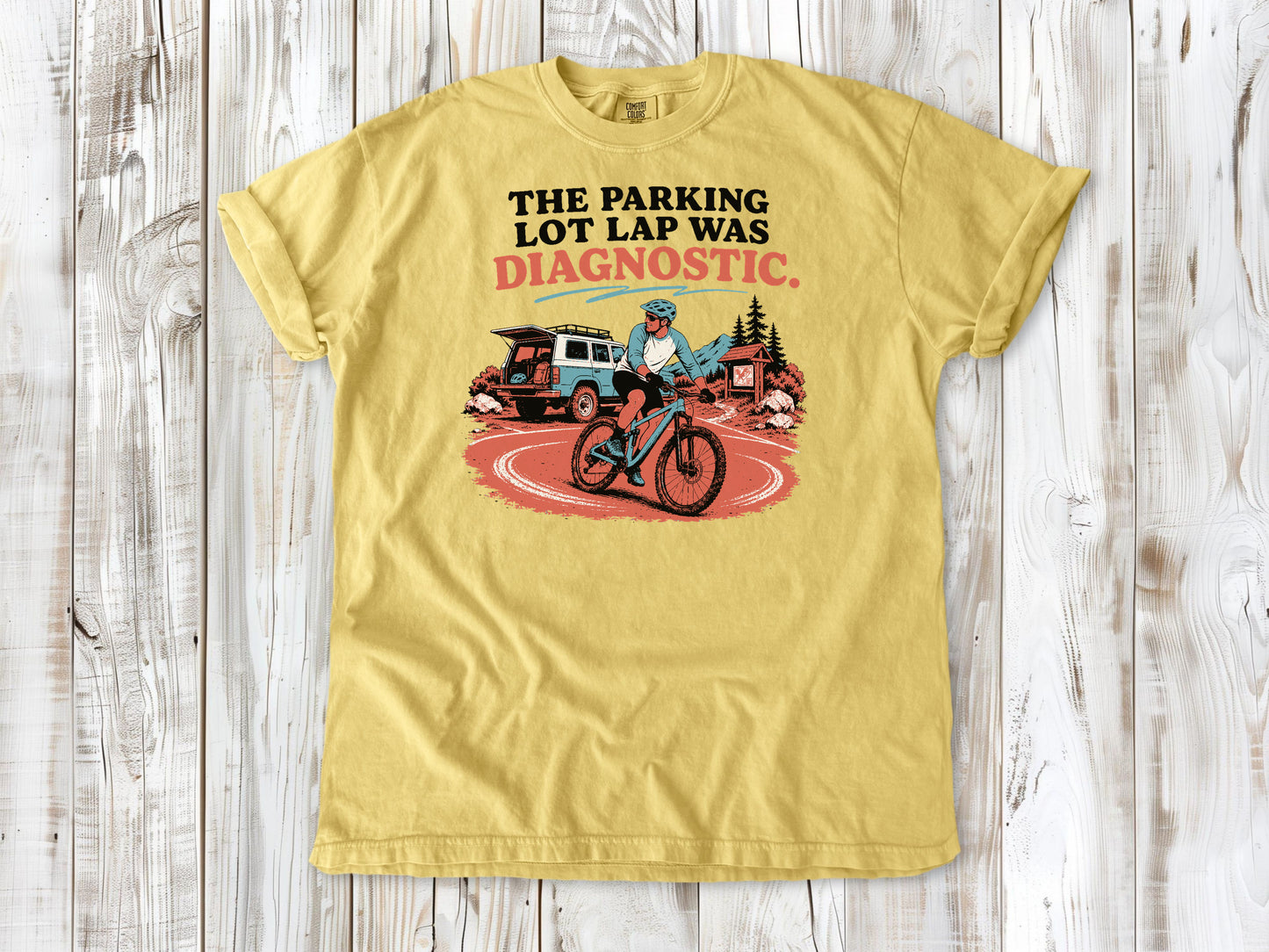 Grey garment-dyed tee with The Parking Lot Lap Was Diagnostic mountain biking graphic.