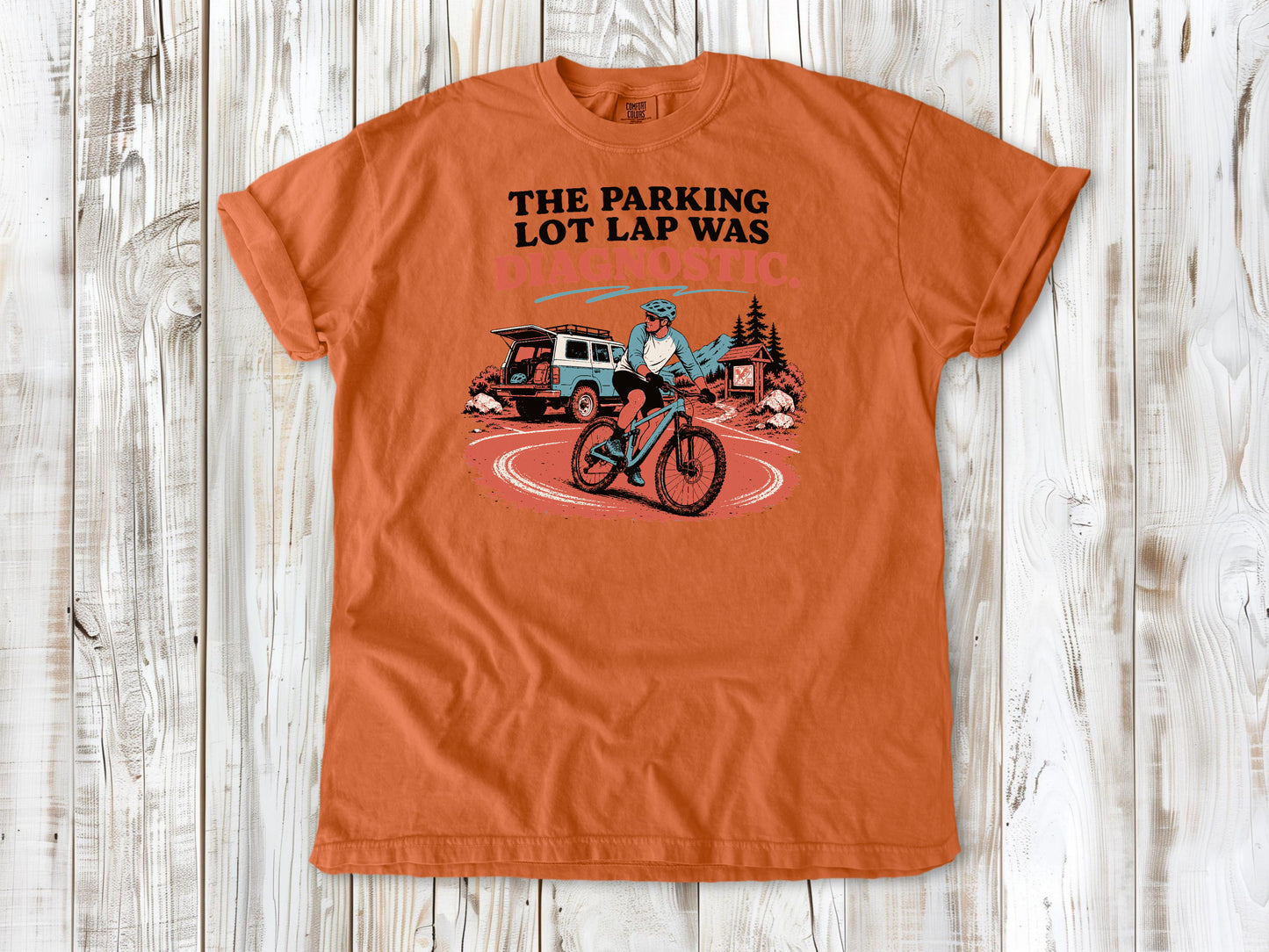 Seafoam garment-dyed tee with The Parking Lot Lap Was Diagnostic mountain biking graphic.