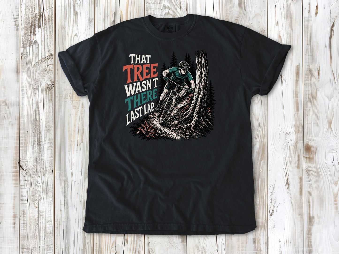 Washed Denim garment-dyed tee with That Tree Wasn't There Last Lap mountain bike trail graphic.