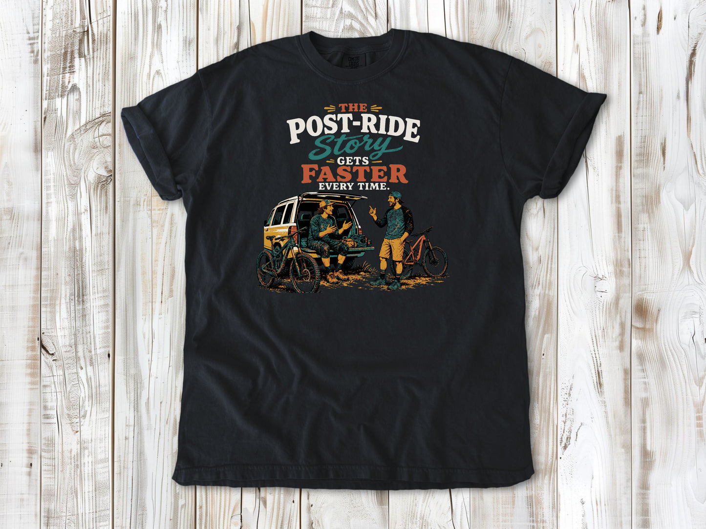 Washed Denim garment-dyed tee with The Post-Ride Story Gets Faster Every Time mountain bike graphic.