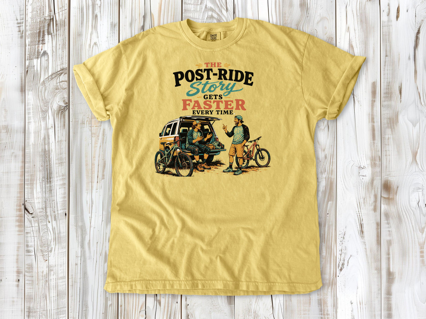 Grey garment-dyed tee with The Post-Ride Story Gets Faster Every Time mountain bike graphic.