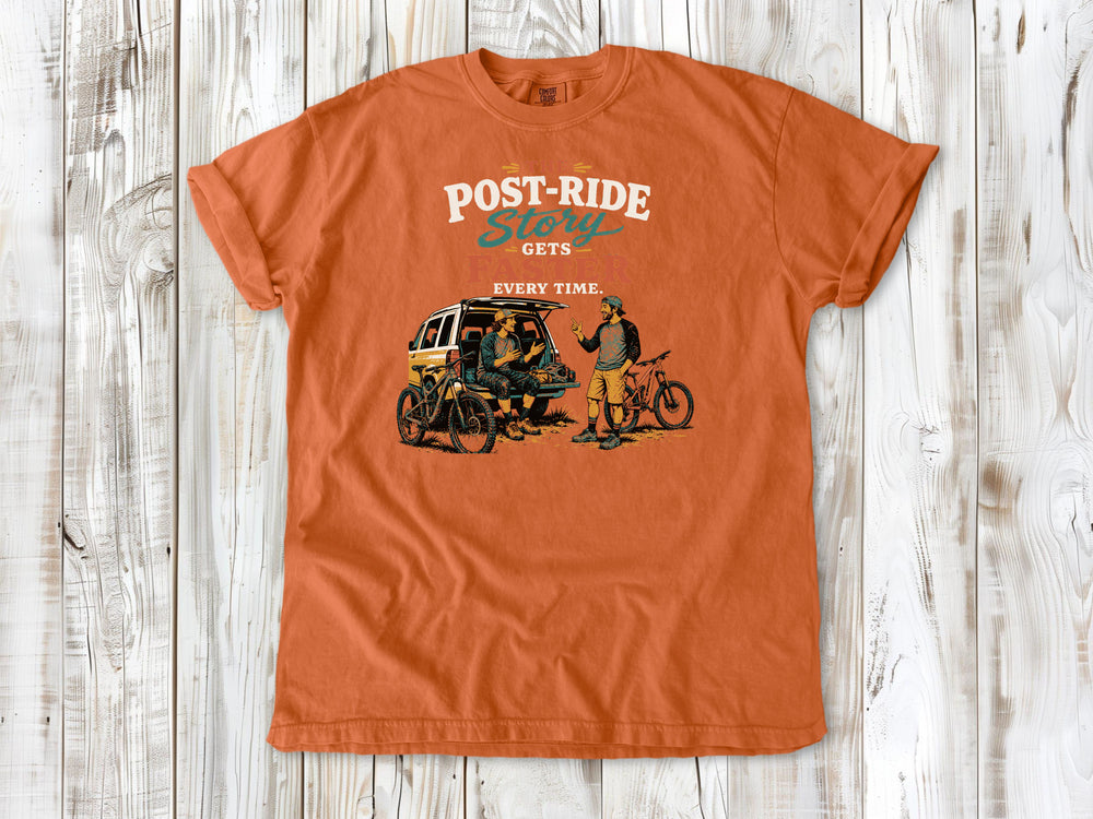 Seafoam garment-dyed tee with The Post-Ride Story Gets Faster Every Time mountain bike graphic.
