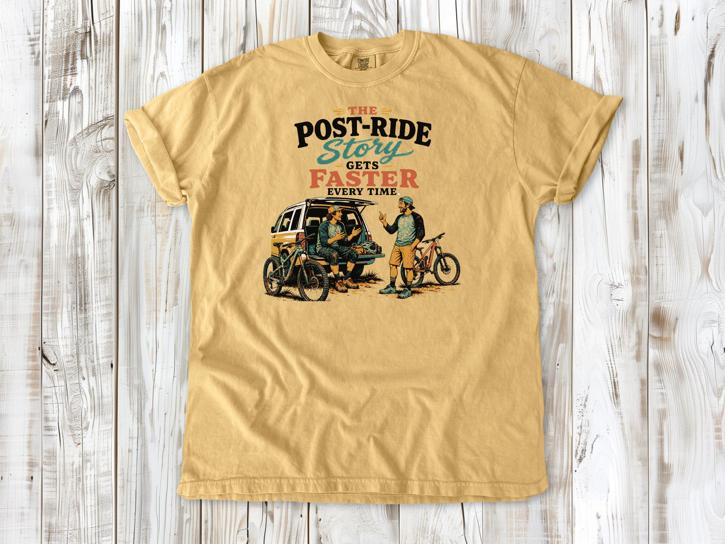 Burnt Orange garment-dyed tee with The Post-Ride Story Gets Faster Every Time mountain bike graphic.