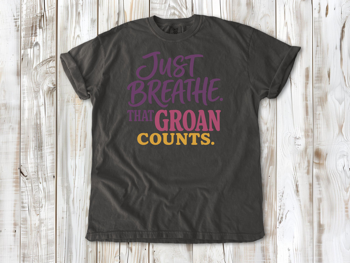 Ivory garment-dyed tee with Just Breathe That Groan Counts yoga graphic.