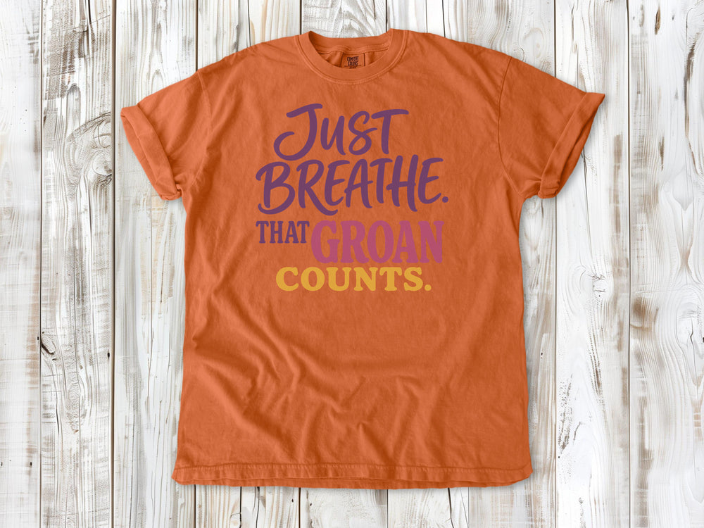 Seafoam garment-dyed tee with Just Breathe That Groan Counts yoga graphic.