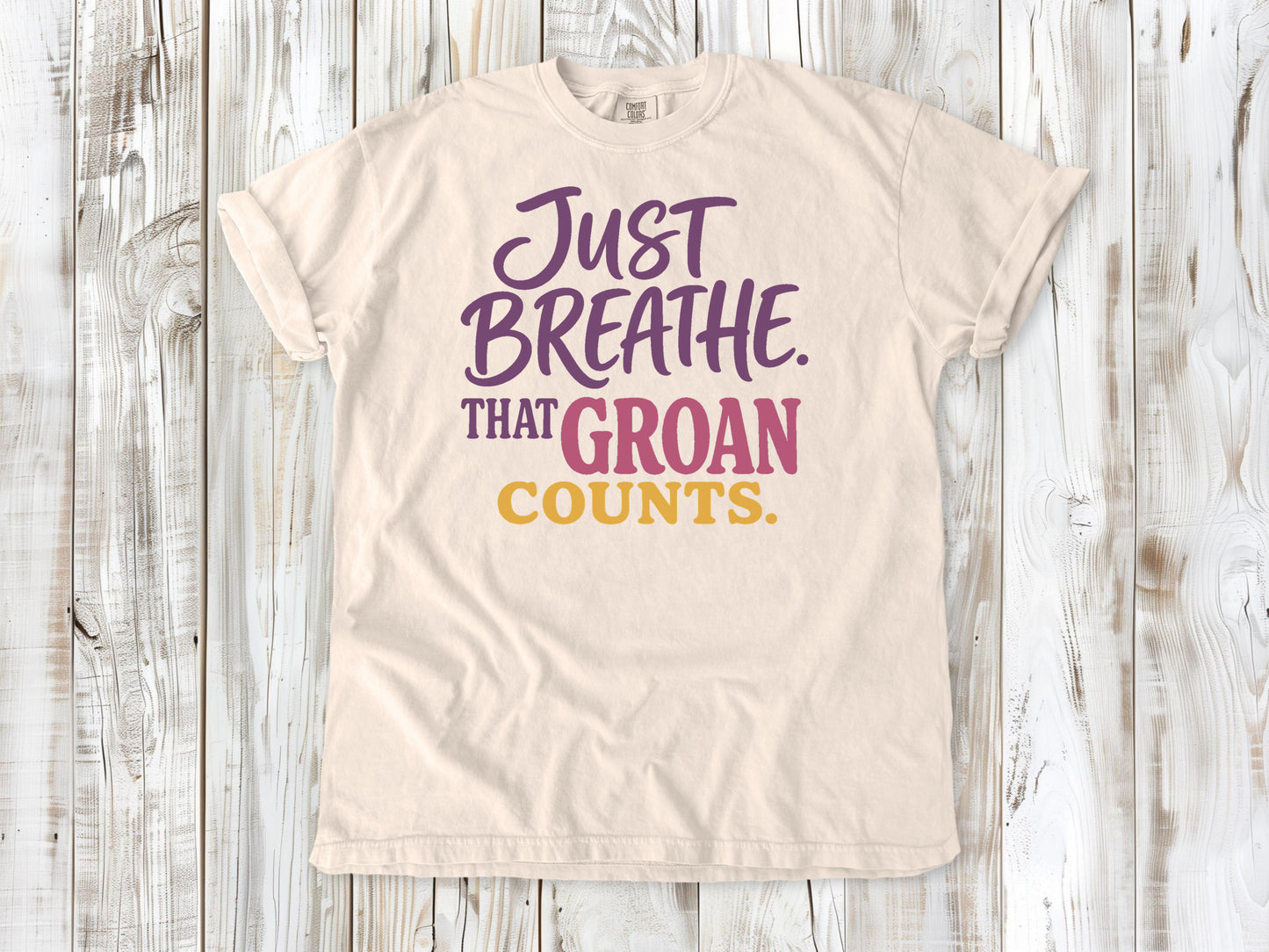 Butter garment-dyed tee with Just Breathe That Groan Counts yoga graphic.