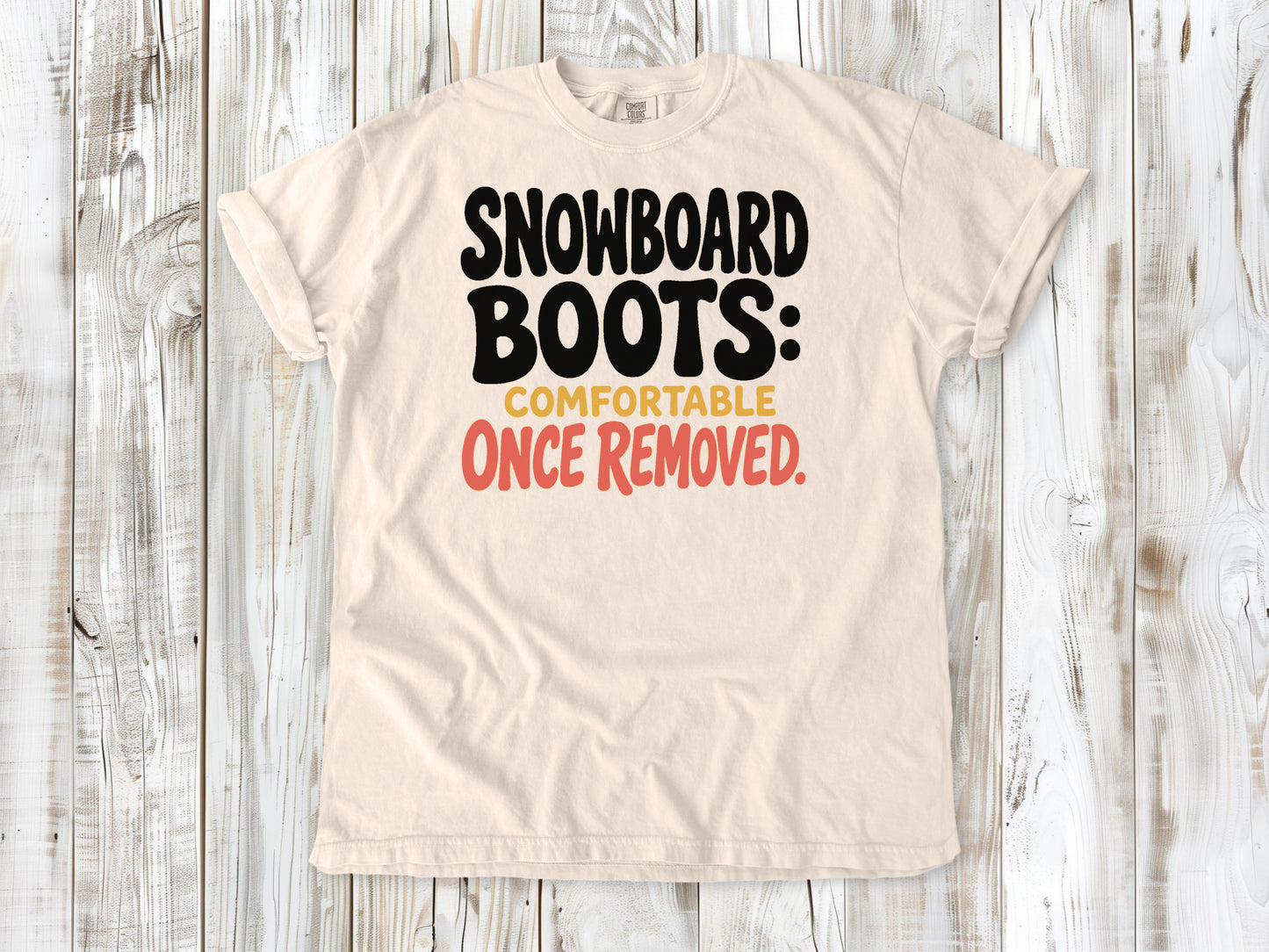 Butter garment-dyed tee with Snowboard Boots Comfortable Once Removed graphic.