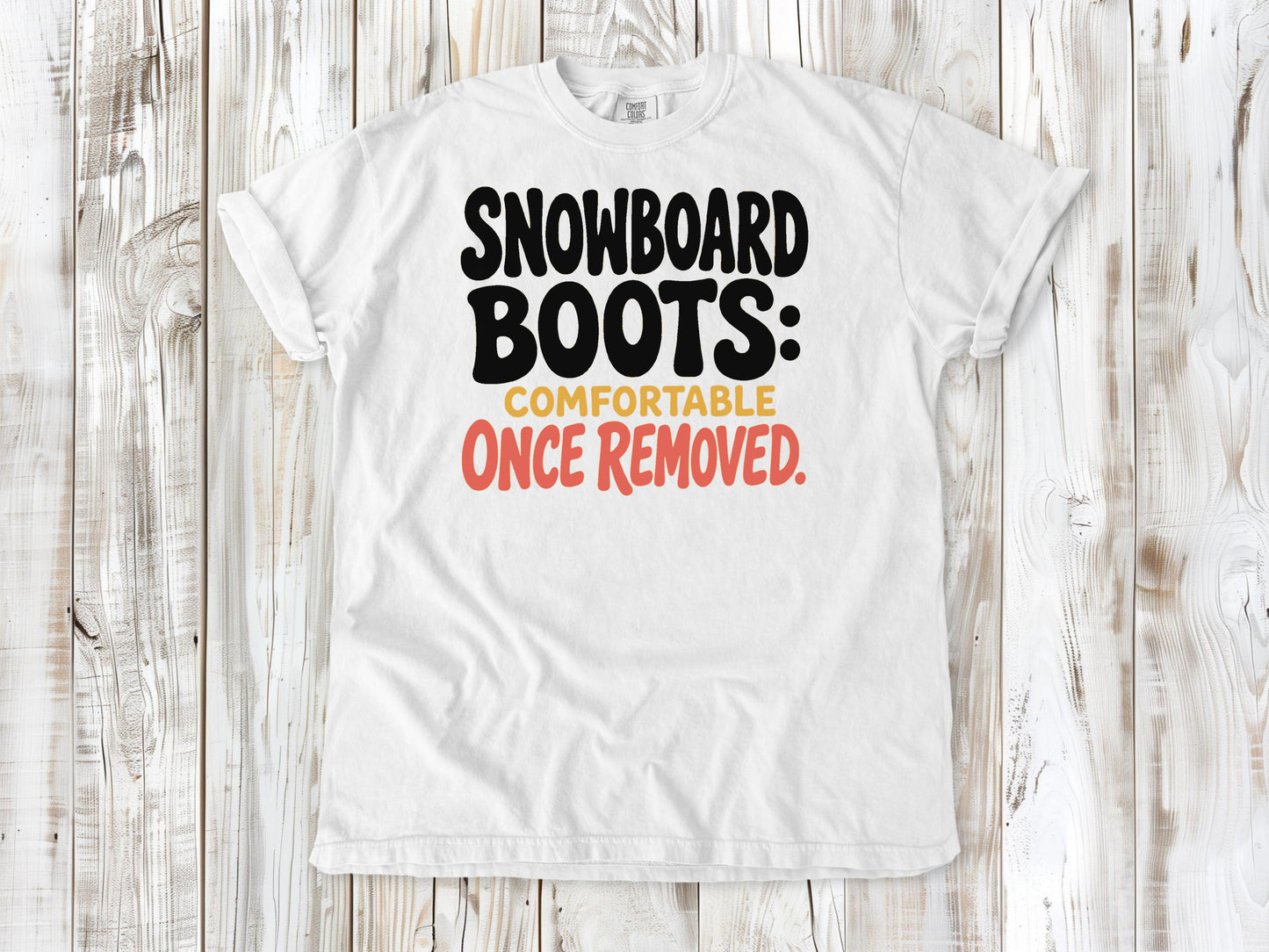 White garment-dyed tee with Snowboard Boots Comfortable Once Removed graphic.