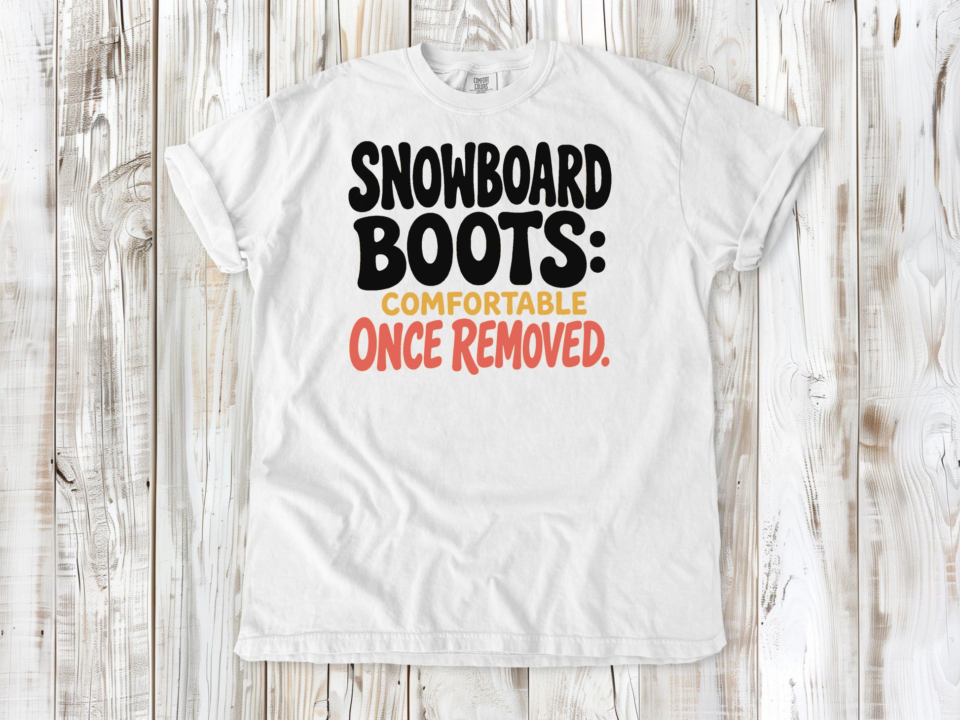 White garment-dyed tee with Snowboard Boots Comfortable Once Removed graphic.