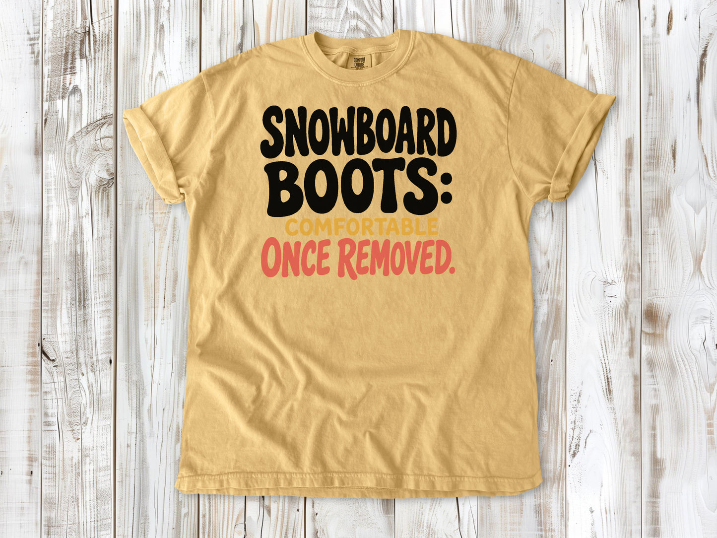 Burnt Orange garment-dyed tee with Snowboard Boots Comfortable Once Removed graphic.