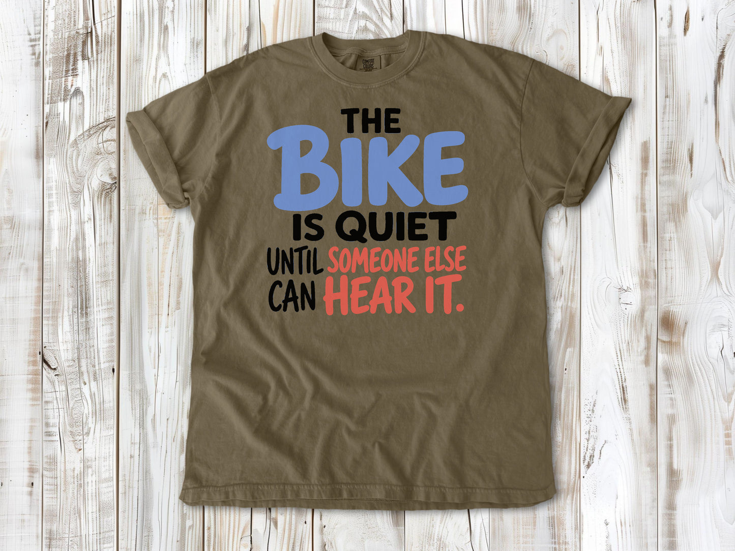 Graphite garment-dyed tee with The Bike Is Quiet Until Someone Else Can Hear It cycling graphic.