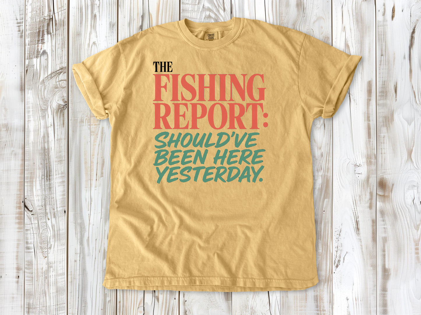 Burnt Orange garment-dyed tee with The Fishing Report Should've Been Here Yesterday graphic.