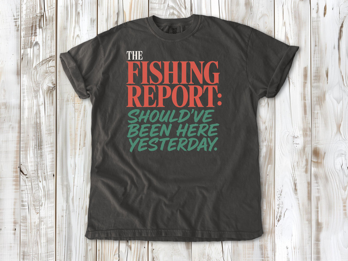 Ivory garment-dyed tee with The Fishing Report Should've Been Here Yesterday graphic.