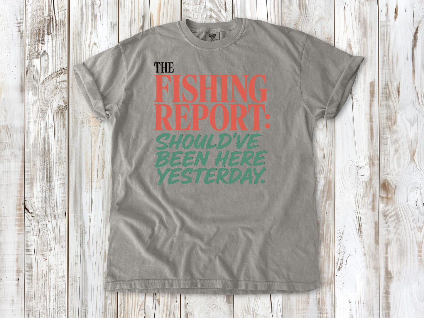 Khaki garment-dyed tee with The Fishing Report Should've Been Here Yesterday graphic.