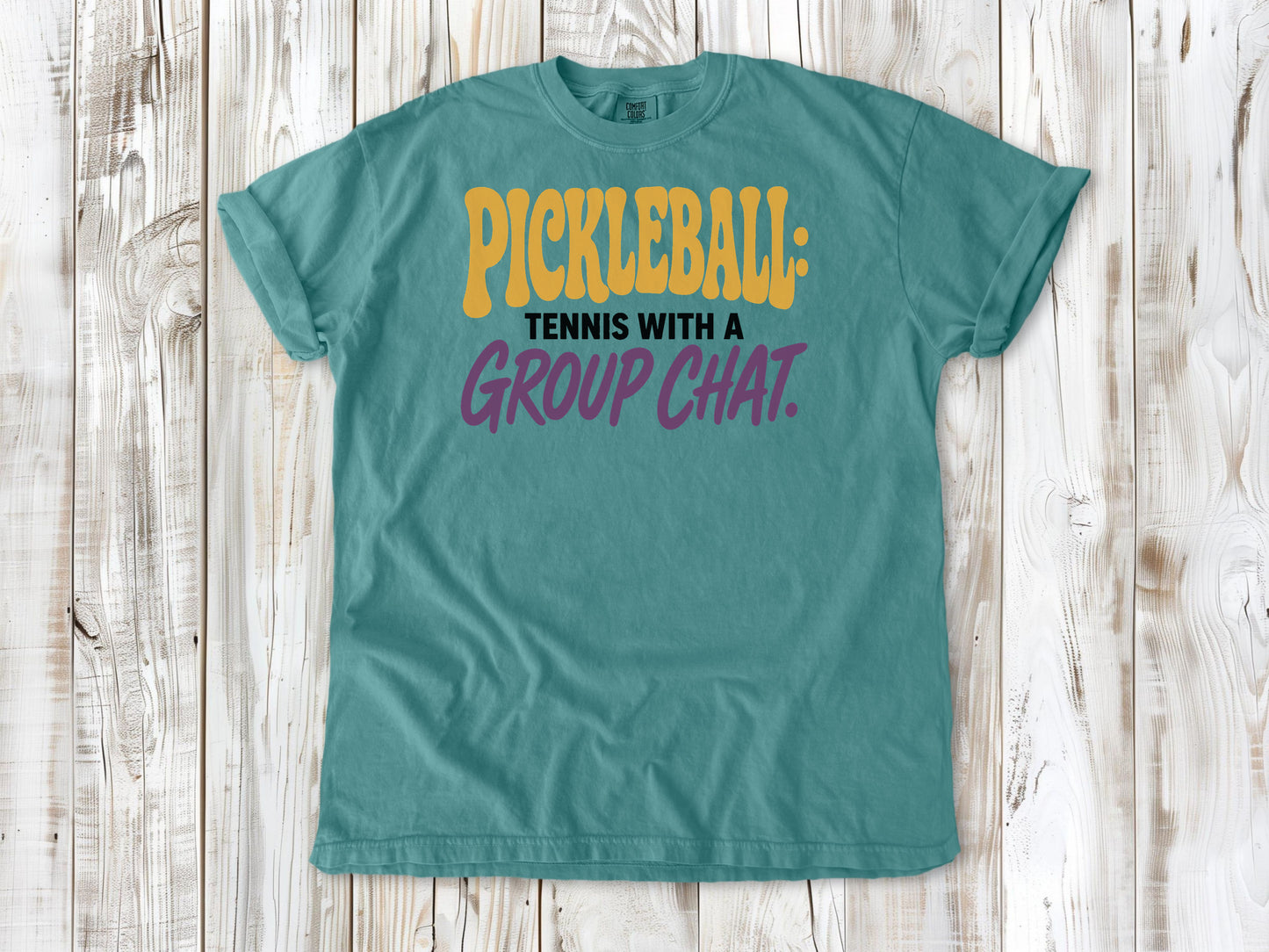 Mustard garment-dyed tee with Pickleball Tennis With a Group Chat graphic.