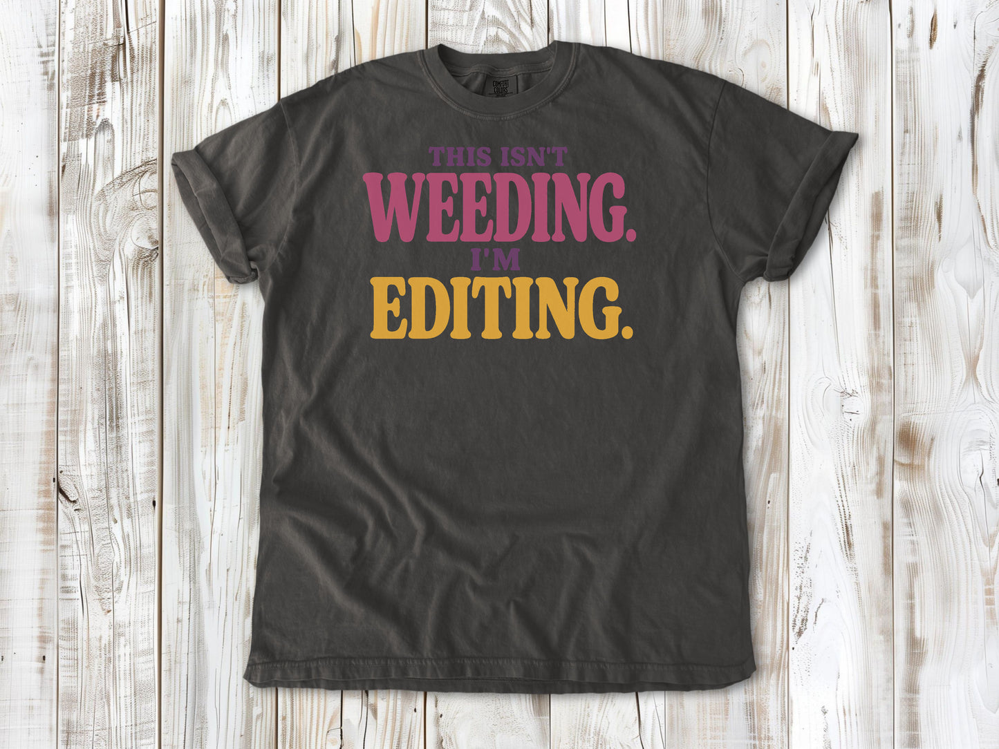 Ivory garment-dyed tee with This Isn't Weeding I'm Editing gardening graphic.