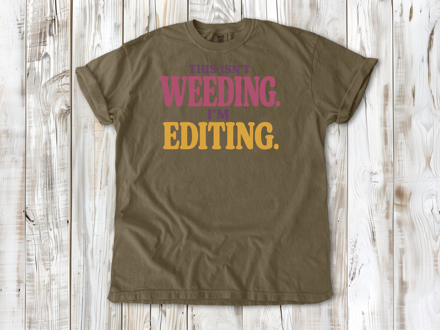 Graphite garment-dyed tee with This Isn't Weeding I'm Editing gardening graphic.