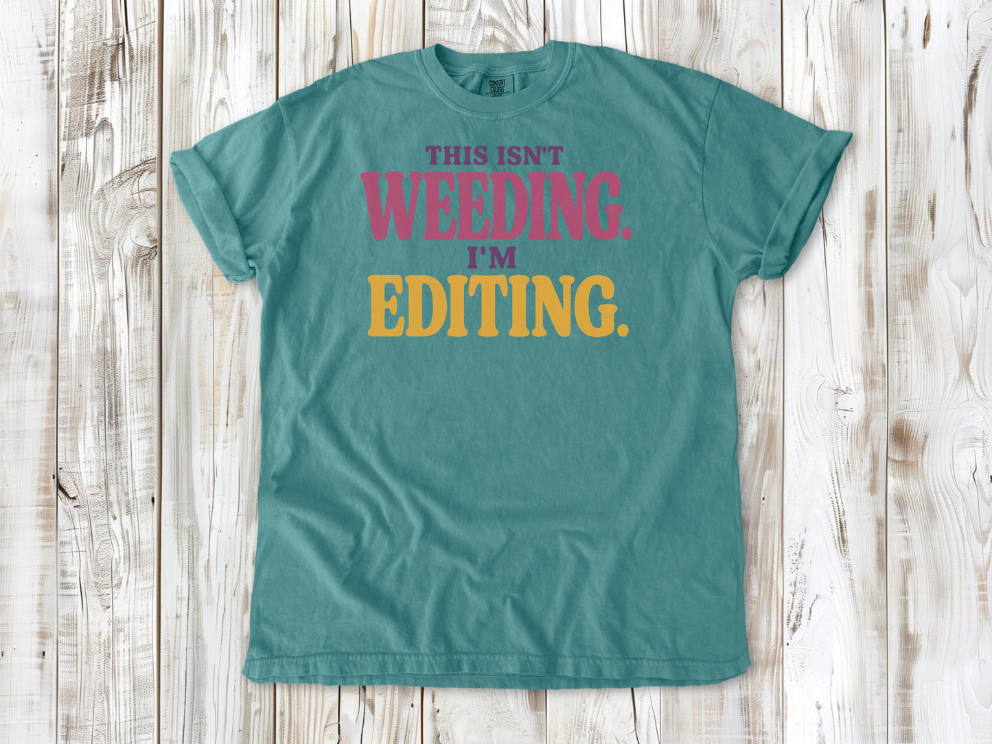Mustard garment-dyed tee with This Isn't Weeding I'm Editing gardening graphic.
