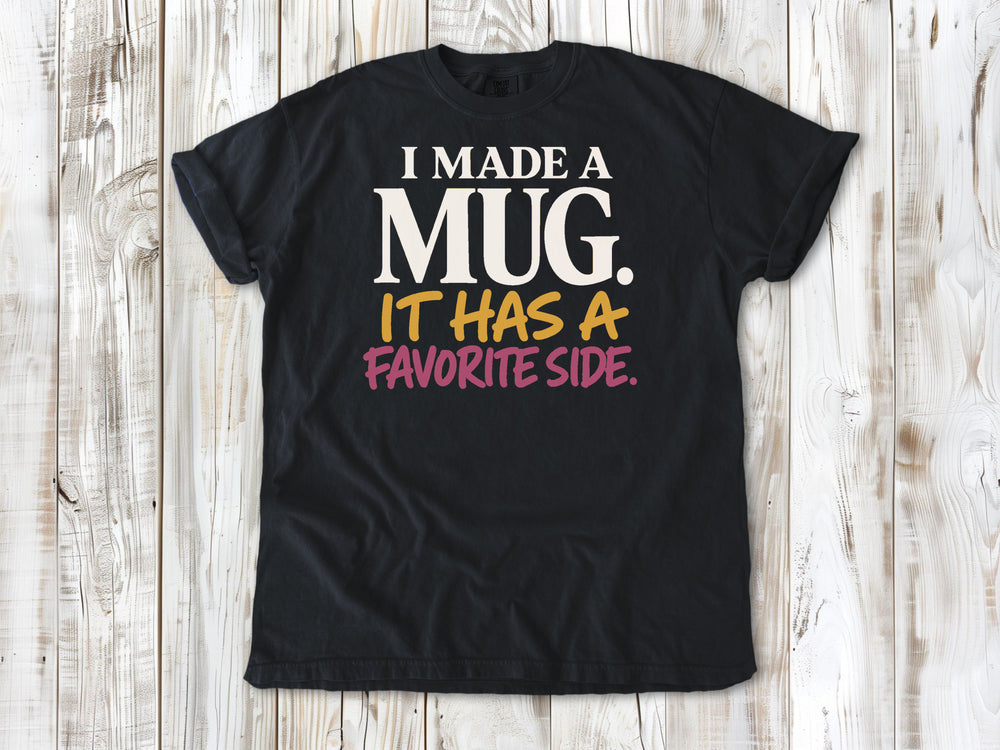 Washed Denim garment-dyed tee with I Made a Mug It Has a Favorite Side pottery graphic.